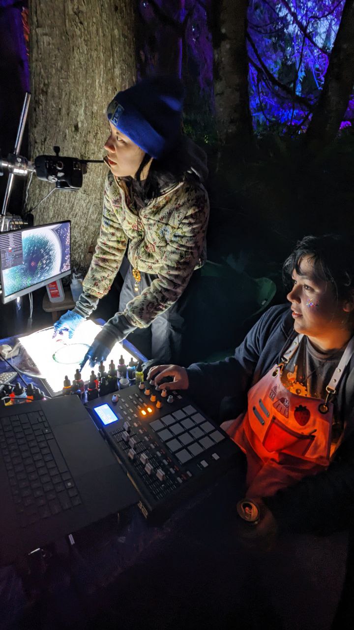 The technical setup including a MIDI controller and laptop running TouchDesigner
